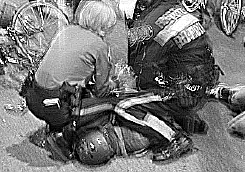 cops kneel 
on rider